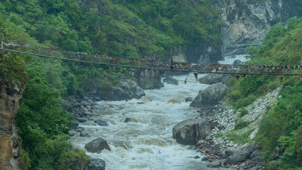 Scenic crossings on the suspension bridge to Lhuentse