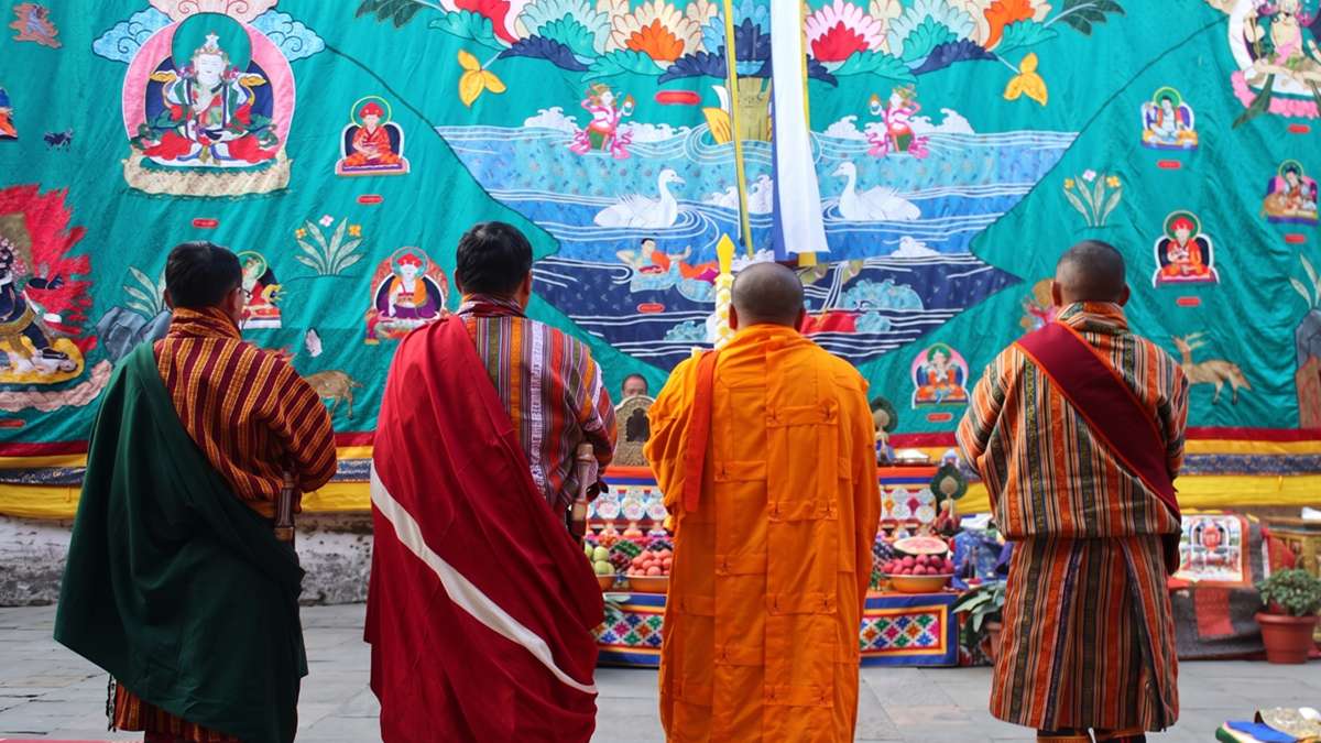 Sacred blessings during the Thongdrel unfurling at Mongar Tshechu
