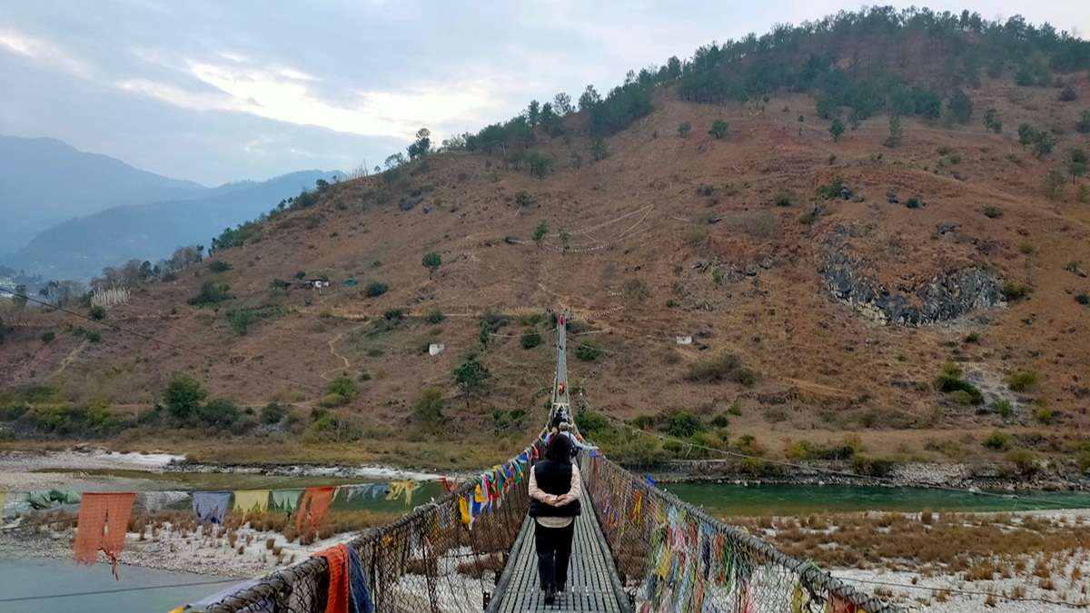 Cross Bhutan iconic Punakha Suspension Bridge