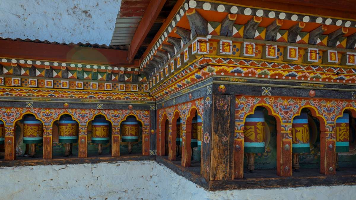 Spin prayer wheels at peaceful Cheri Monastery