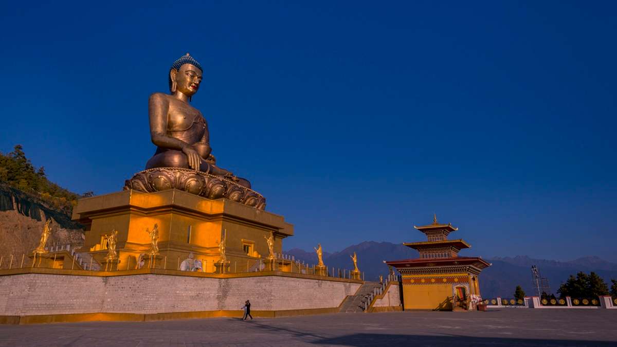 Witness sunrise illuminating the majestic Buddha Dordenma