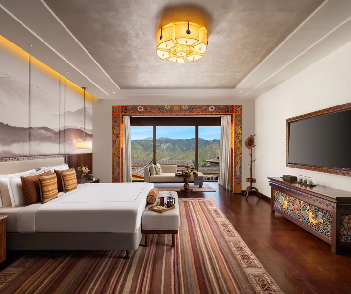 A Bhutanese luxury suite in Paro with hand-painted timberwork and mountain views